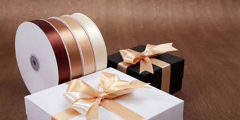 Custom grosgrain and satin ribbons tied on luxury bag packaging