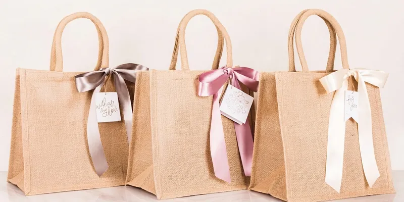 Jute gift bags with ribbon handles and bows