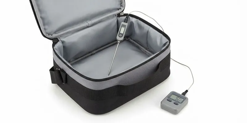 Insulated lunch bag with a temperature probe wired to a digital data logger