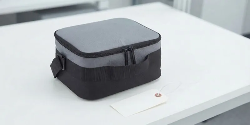 Opened lunch bag with internal divider compartments checked before approval