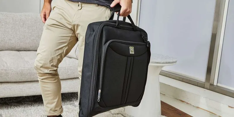 Garment duffle carrying a suit, held like soft luggage