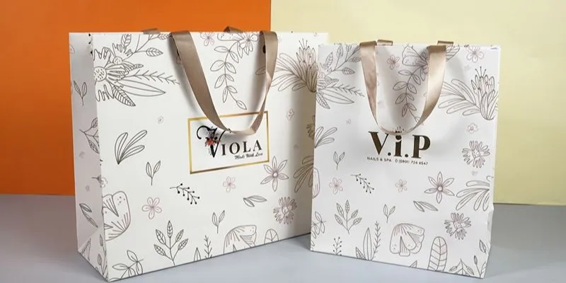 Laminated art paper gift bags with glossy printed panels